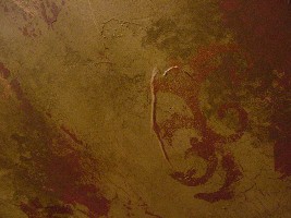 Detail of layered texture, crackle, and several glazes with metallic design