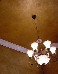 Golden metallic ceiling finish with walnut glaze